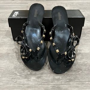 Melissa black with gold flip flops size 7